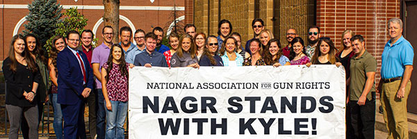 National Association for Gun Rights and National Foundation for Gun Rights staff stand with Kyle Rittenhouse